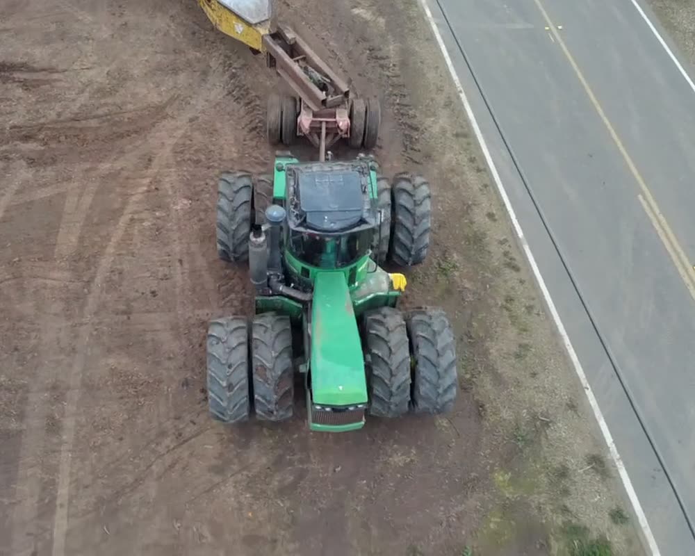 Tractor and grinder on a Ceja Farms job site